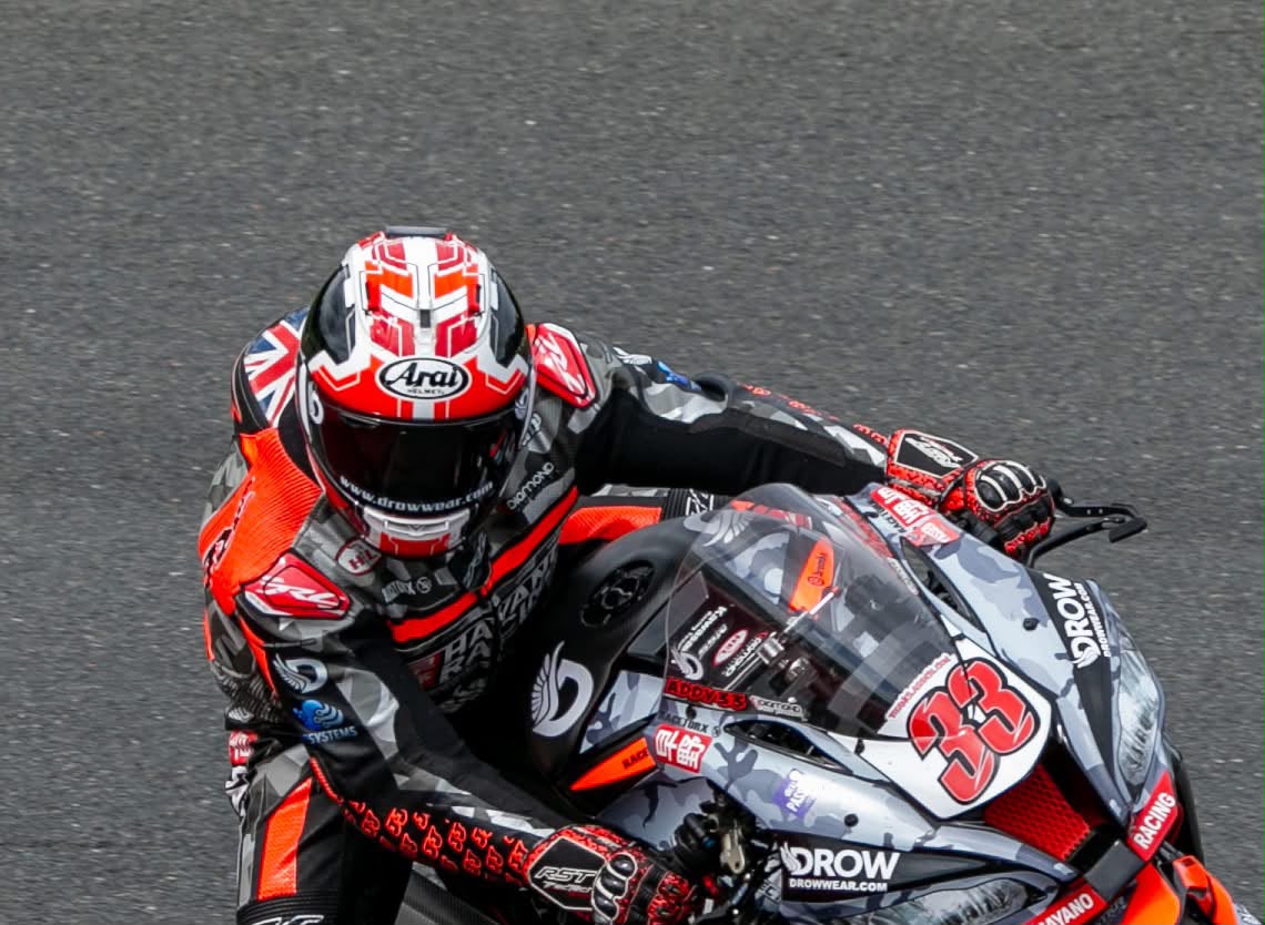 Adam Brown tucked behind the screen of the number 33 Kawasaki ZX-10R