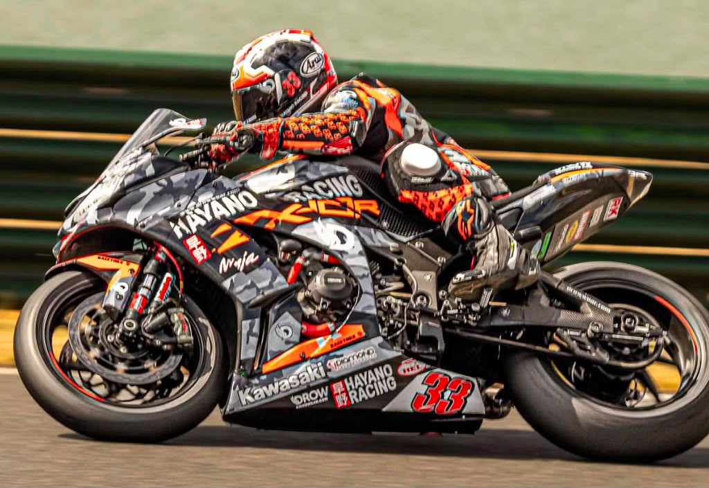 Adam Brown riding the number 33 Kawasaki ZX-10R at speed
