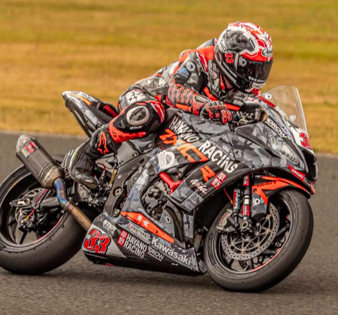 Adam Brown leaning the number 33 Kawasaki ZX-10R into a corner