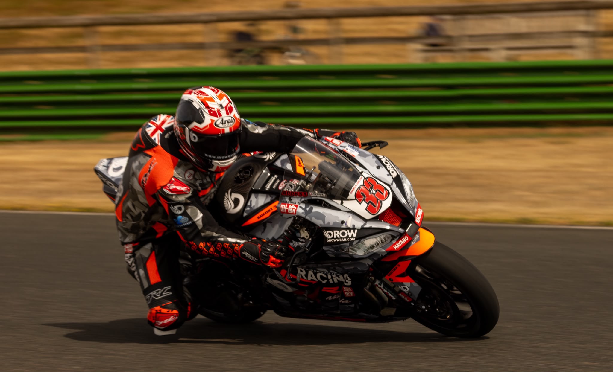 Adam Brown at full lean on the number 33 Kawasaki ZX-10R