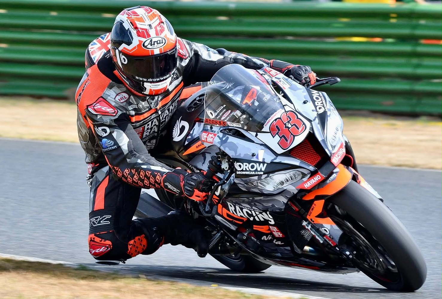 Adam Brown with knee down on the number 33 Kawasaki ZX-10R