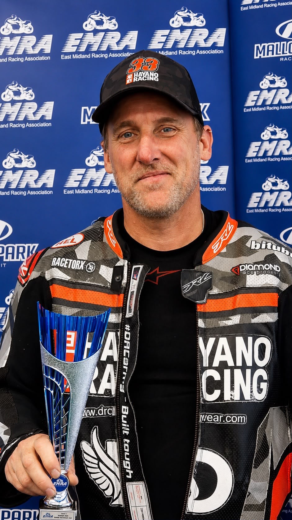 Adam Brown holding his third-place EMRA trophy