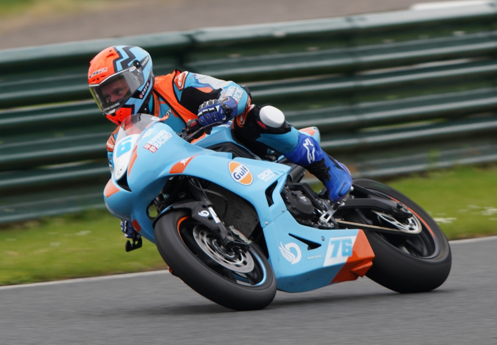 Adrian Stowe riding the Gulf-coloured number 76 Triumph 765RS