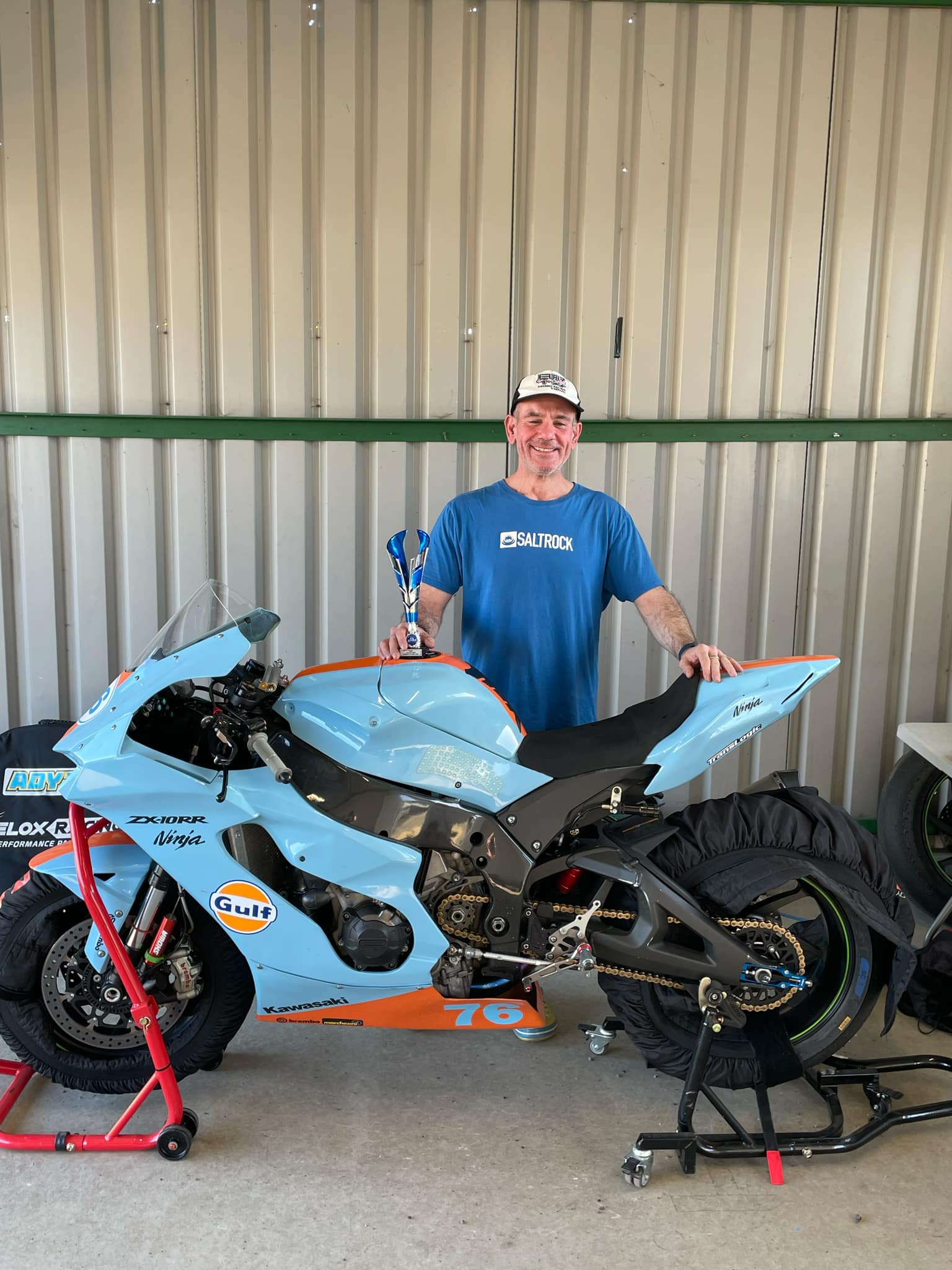 Adrian Stowe with the number 76 motorcycle and Rookie trophy