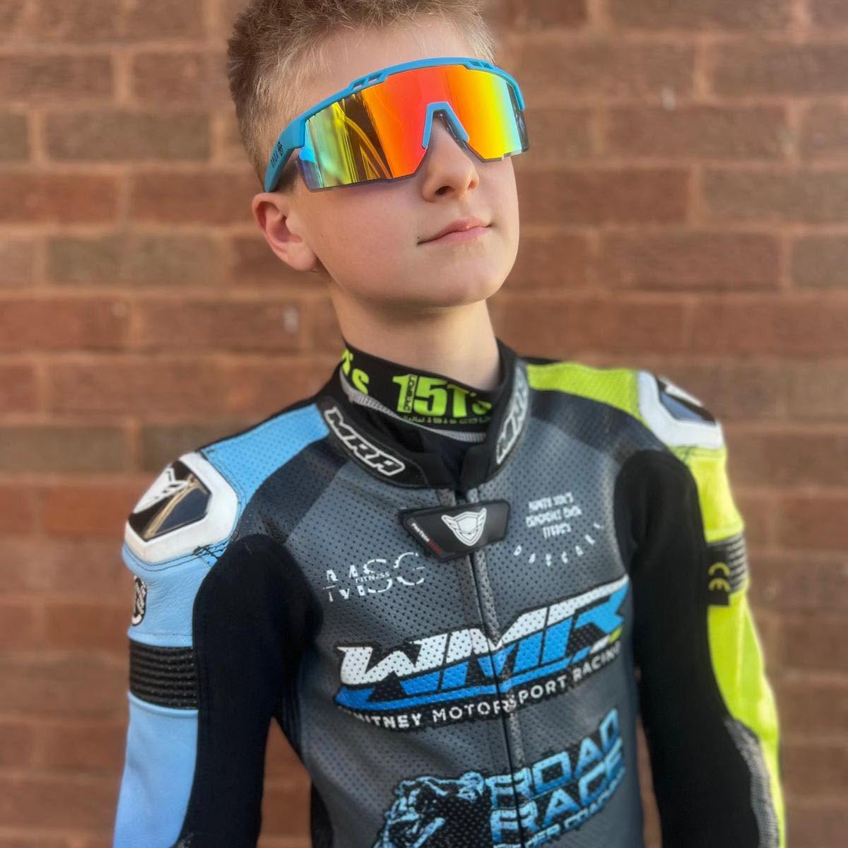 Josh Perkins wearing his race leathers and mirrored sunglasses